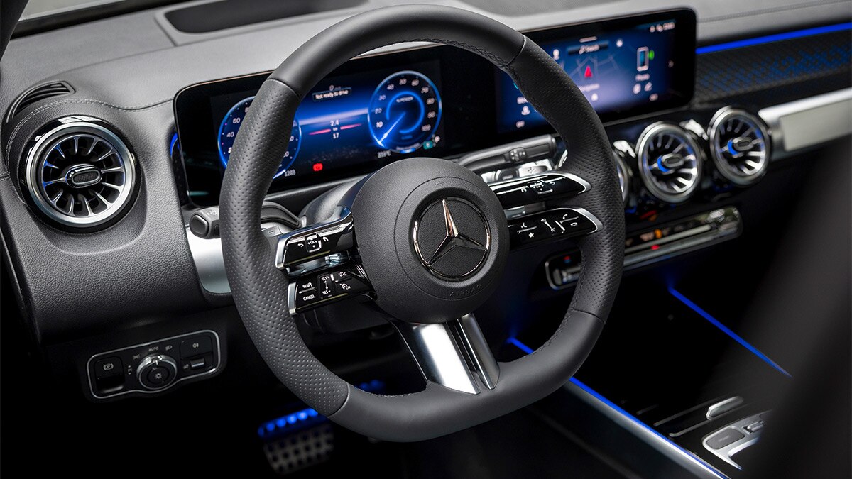 The mildly flat-bottom steering wheel of the EQB has numerous touch-sensitive controls that require some accustomization.