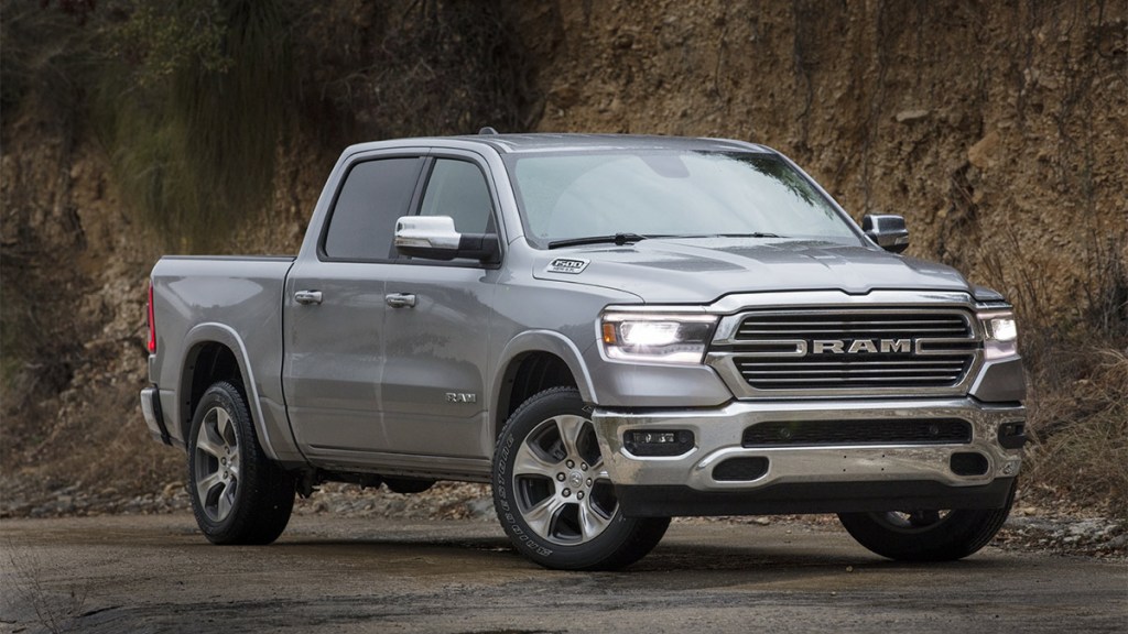 2024 Ram 1500 in grey parked on dirt road.