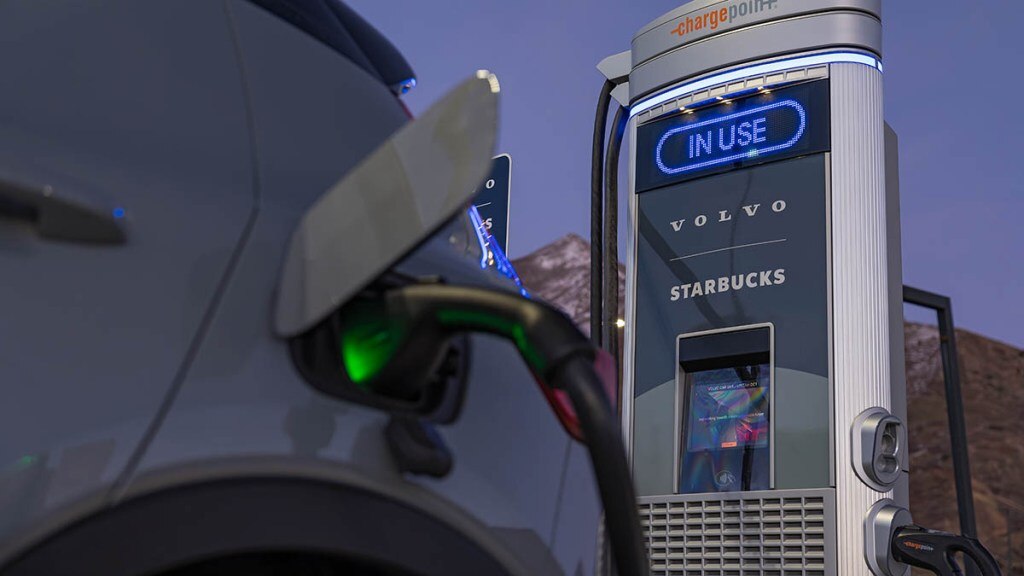 A 2024 Volvo XC40 Recharge charging at a Starbucks location.