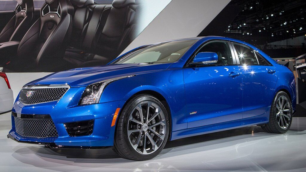 2014 Cadillac ATS in blue in a showroom.