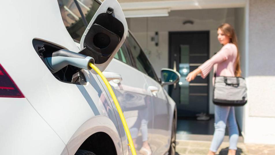 Homeowner charging an electric car.