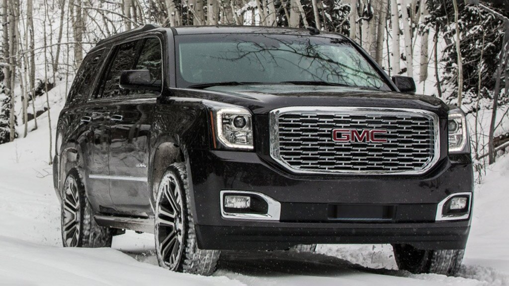 2018 GMC Yukon in black and on snow.
